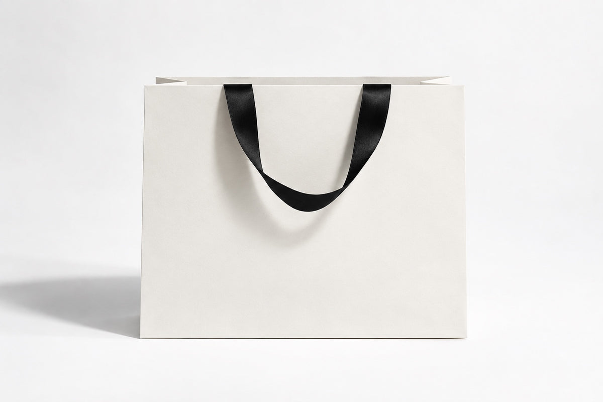 Plain white paper bag with black satin handles